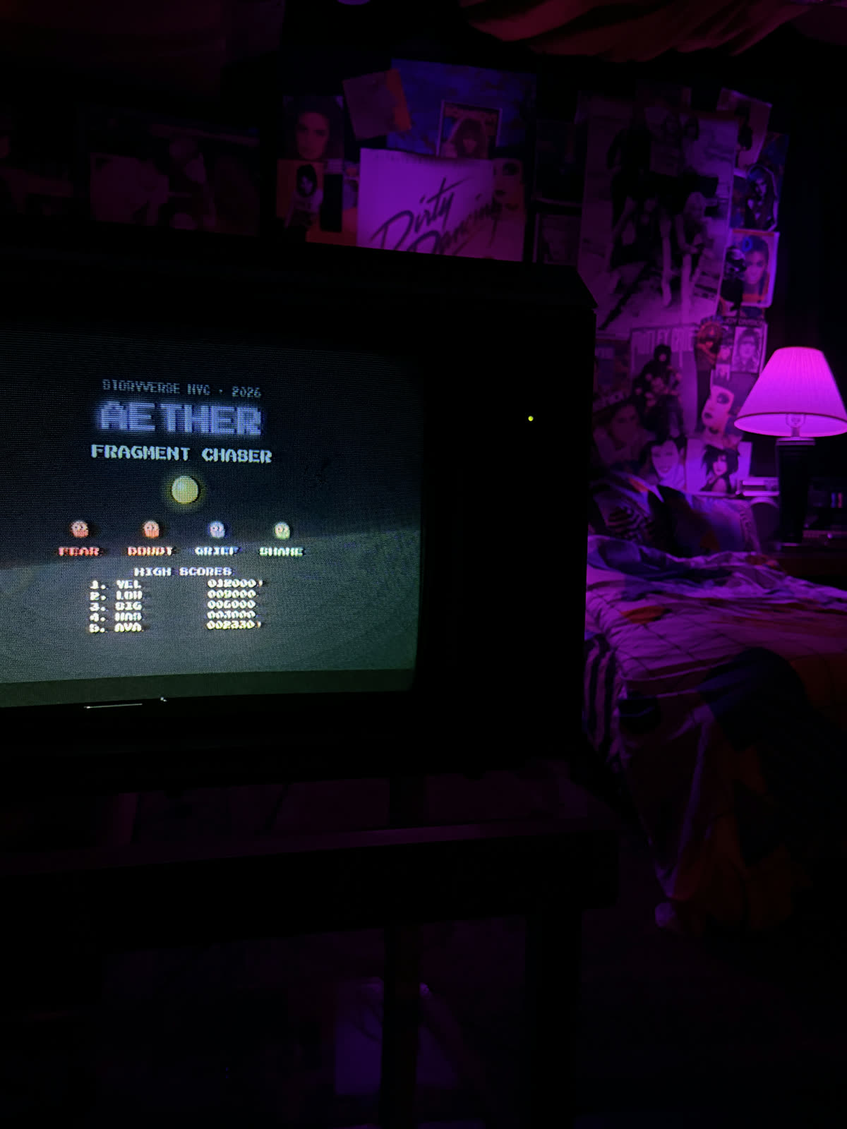 The arcade game's title screen on a CRT in the AETHER installation